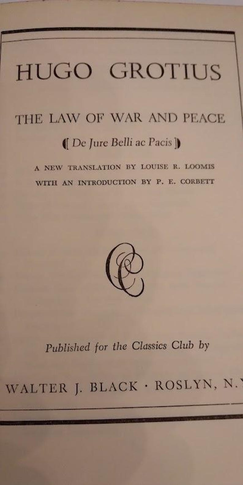 May include: A book page with the title "HUGO GROTIUS" and "THE LAW OF WAR AND PEACE". The text includes "De Jure Belli ac Pacis", a new translation by Louise R. Loomis, and an introduction by P. E. Corbett. Published by Walter J. Black.