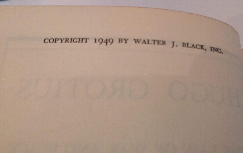 May include: A close-up of a book page with the text "COPYRIGHT 1949 BY WALTER J. BLACK, INC." printed in black. The page is off-white, and the text is centered at the top.