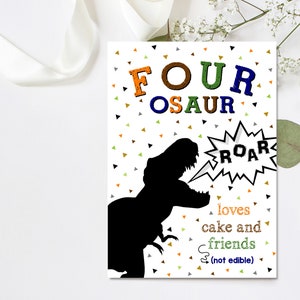 May include: A white card with a black dinosaur silhouette, a speech bubble with the word "ROAR" and the text "FOUR OSAUR loves cake and friends (not edible)". The background is white with colorful confetti.