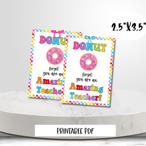 May include: Two printable 2.5" x 3.5" gift tags with a donut design. The tags are pink, yellow, blue, green, and orange with white polka dots. The text on the tags reads "Don't forget you are an amazing teacher!"