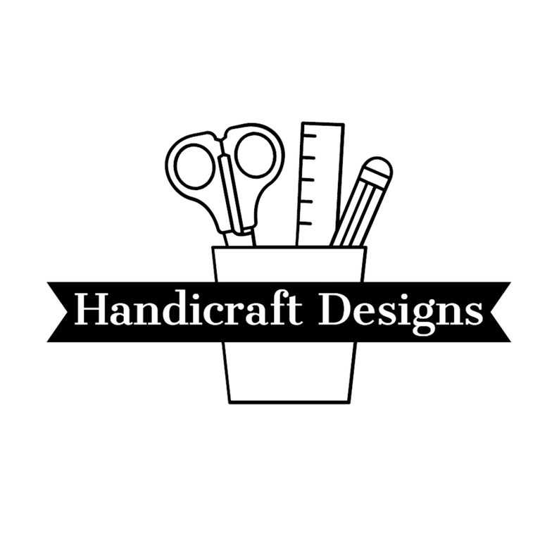 May include: Black and white line drawing of a pencil, ruler, and scissors in a cup. The cup has a black ribbon with the text "Handicraft Designs" on it.