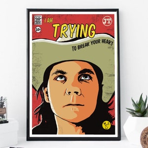 Könnte beinhalten: Ein Vintage-Comic-Cover mit rotem Hintergrund und dem Titel "I AM TRYING TO BREAK YOUR HEART". Das Cover zeigt einen Mann mit langen dunklen Haaren, der einen Cowboyhut trägt und nach oben schaut.