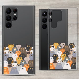 May include: A clear phone case with a black phone inside. The phone case has a design of many colourful cartoon cats on the back. The phone case is designed to fit a Samsung Galaxy S21 Ultra.