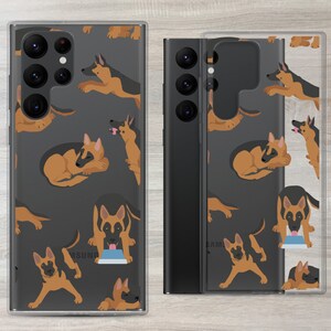 May include: Clear phone case with a repeating pattern of German Shepherd dogs in various poses on a dark gray background. The case is designed for a Samsung Galaxy phone.
