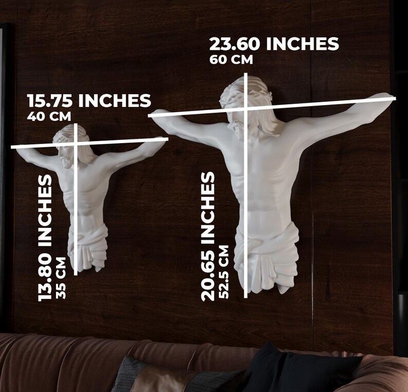 May include: Two white wall sculptures of a figure with outstretched arms, one measuring 40 cm wide and 35 cm tall, the other 60 cm wide and 52.5 cm tall. The sculptures are mounted on a dark brown wall. Measurements are provided in inches and cm.