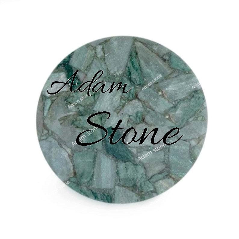 May include: Round, green stone coaster with a mosaic pattern. The coaster has the words "Adam Stone" in a black script font. The stone has a mix of light and dark green hues.