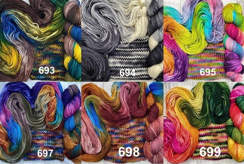 May include: Six sets of hand-dyed yarn skeins and knitted swatches labelled 693 through 699. Each set features distinct colour palettes including earth tones, monochromatic greys, vibrant rainbows, and deep jewel tones in various fibre textures.