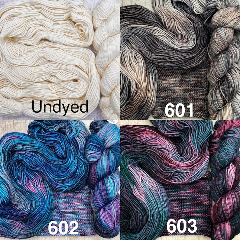 May include: Four skeins of yarn with corresponding knitted swatches. The top left is labelled Undyed in cream. The top right is labelled 601 in shades of brown and grey. Bottom left is 602 in blue and purple. Bottom right is 603 in pink and teal.