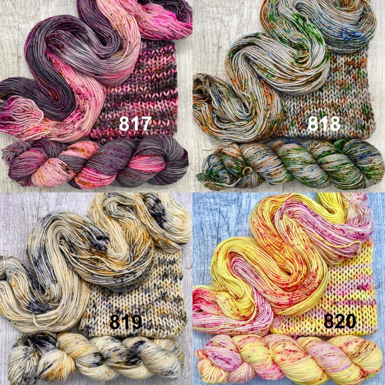 May include: Four skeins of hand-dyed yarn with matching knitted swatches, labelled 817, 818, 819, and 820. The yarn features variegated colourways including pink and purple, grey and green, cream and black, and yellow and pink.