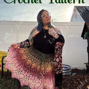 May include: A crochet pattern document featuring a skirt with a gradient colour scheme transitioning from olive green at the waist to pink at the hem. The skirt has a detailed lace design and a drawstring waist. The text reads Crochet Pattern.