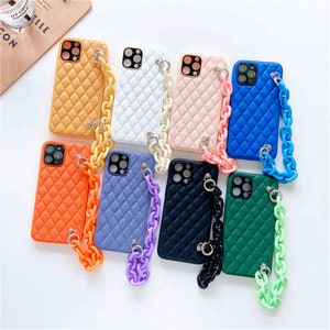 May include: Ten quilted phone cases with matching chain straps in various colours, including orange, blue, green, black and white.