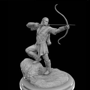 May include: A grey figurine of a person holding a bow and arrow, standing on a rock base. The figurine is posed in a dynamic action pose, with the person's arm drawn back to release the arrow.
