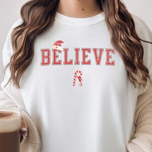 Christmas Believe Shirt, Spiritual Christmas Faith Sweater, Santa Christmas Pullover, Magic of Christmas Pajamas Fun Festive Holiday Shirt