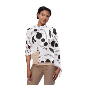 May include: A white ceramic mug with a black handle and the text "But First, Coffee" in a handwritten style. The mug is on a white surface. The mug is approximately 4 inches tall.