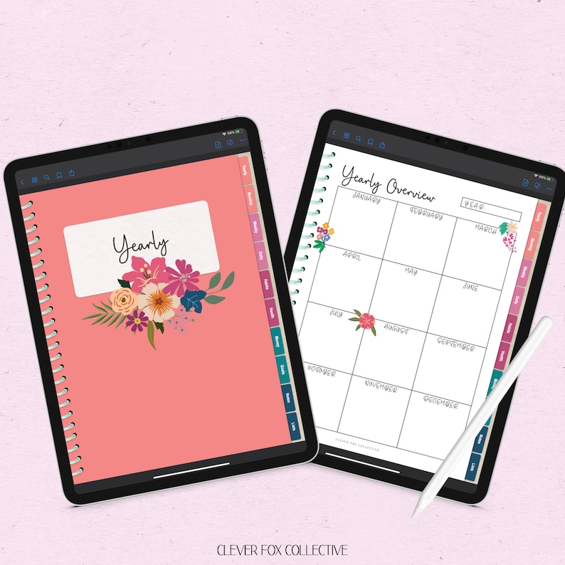 May include: Two digital planners displayed on tablets. One is coral with "Yearly" and floral decorations. The other shows a yearly overview calendar. A white stylus rests on the second tablet. The text "CLEVER FOX COLLECTIVE" is at the bottom of the image.