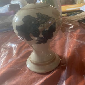 Leaf vine flower vase floral flowers stoneware ? Pottery pot water holder around cylinder circle circular green tan ring vines vine ivy ?