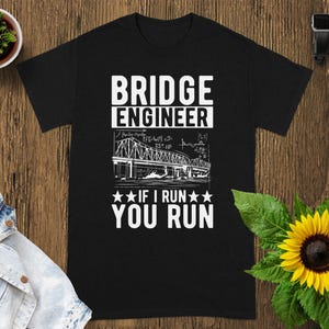 May include: A black short-sleeve t-shirt featuring white text that reads BRIDGE ENGINEER and IF I RUN YOU RUN, along with a graphic illustration of a bridge and mathematical equations printed in the center of the chest area.