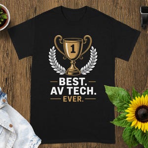 May include: Black t-shirt featuring a gold trophy with the number 1, surrounded by a white laurel wreath. The text reads "BEST. AV TECH. EVER." A perfect gift for an audio-visual technician.