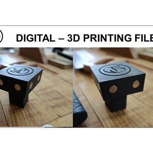 以下が含まれることがあります： 円形のロゴと各側に3つの磁石が付いた、黒色の3Dプリントされたコーナークランプが2つあります。画像の上部には「DIGITAL - 3D PRINTING FILES」と書いてあります。