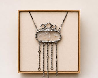 Dandelion seed necklace, with dangling chains. Terrarium necklace.