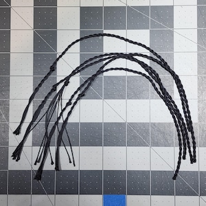 12&quot; long black Kevlar Replacement Poppers/Crackers for most 6-ft+ whips. Bundle of five (5) black crackers 12&quot; long (9&quot; twist / 3&quot; tassel)