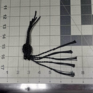 12&quot; long black Kevlar Replacement Poppers/Crackers for most 6-ft+ whips. Bundle of five (5) black crackers 12&quot; long (10&quot; twist / 2&quot; tassel)