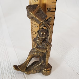 Brass Drunk Man or Hobo Holding up a Light Post
