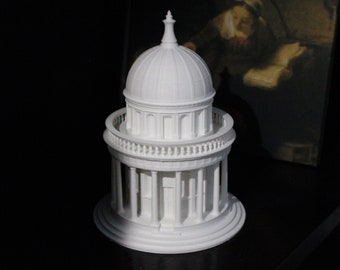 May include: A white 3D printed model of a small building with a dome roof and columns. The model is sitting on a black surface.