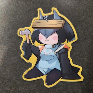 May include: A sticker featuring a cartoon character with a hammer and a wooden plank on their head. The character wears a blue and black outfit with a yellow outline. The hammer is held in the right hand.