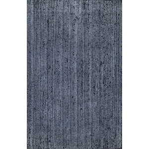 May include: A rectangular, woven rug in a deep navy blue hue. The rug's texture features vertical lines and subtle variations in color, creating a textured appearance. The rug is suitable for indoor use.