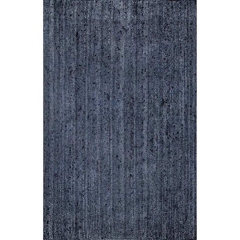 May include: A rectangular, woven rug in a deep navy blue hue. The rug's texture features vertical lines and subtle variations in color, creating a textured appearance. The rug is suitable for indoor use.