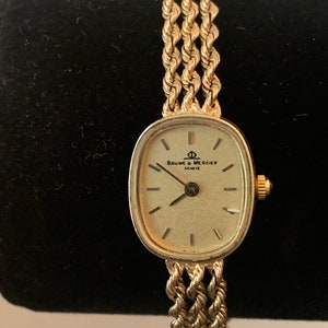 Vintage WristWatch. Baume & Mercier, w/Chain, 14K YG 19.4g, 18cm, 7mm. Collector&#39;s beautiful piece. No guarantee. Sold as is. Preowned 1970.