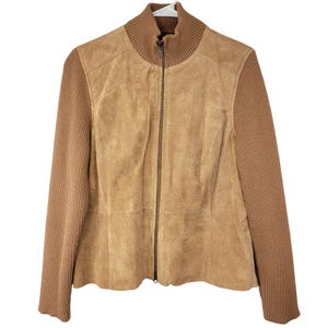 May include: A brown suede jacket with a zipper closure and ribbed knit sleeves.