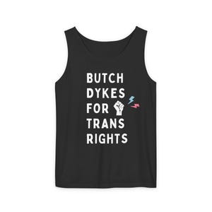 May include: Black tank top with white text that reads "Butch Dykes for Trans Rights". A raised fist with a pink and blue lightning bolt is next to the text.