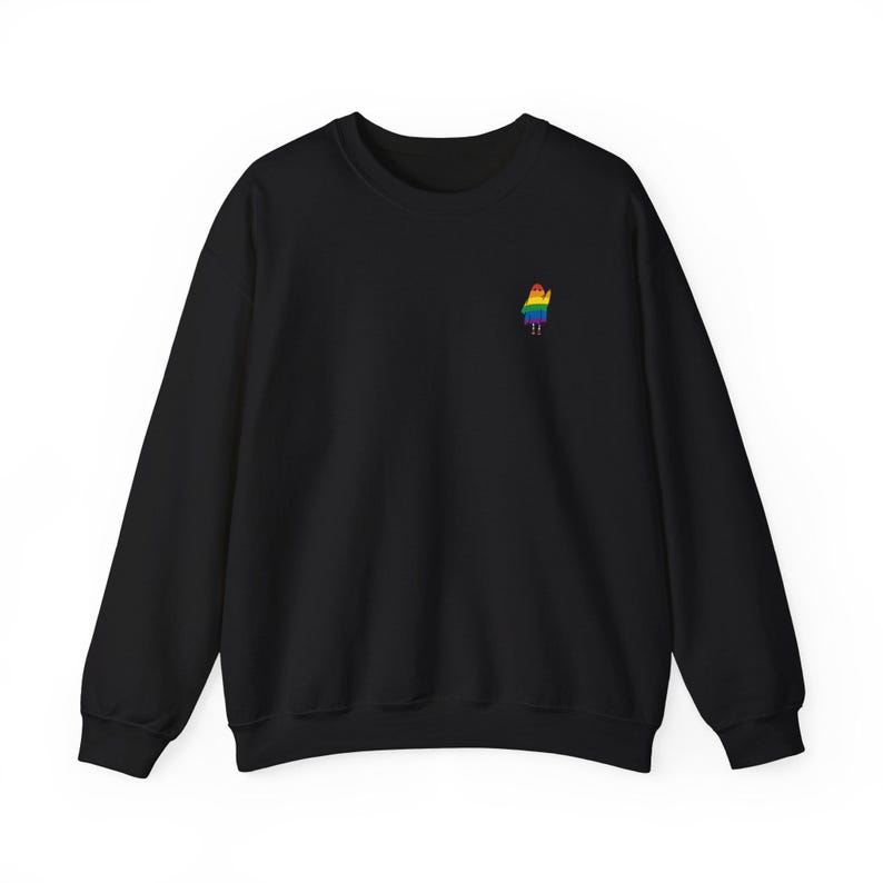 May include: Black crew neck sweatshirt featuring a small, embroidered rainbow figure on the left chest. The figure is a person-shaped design with a rainbow-coloured outfit. The sweatshirt has long sleeves and a classic, casual style.