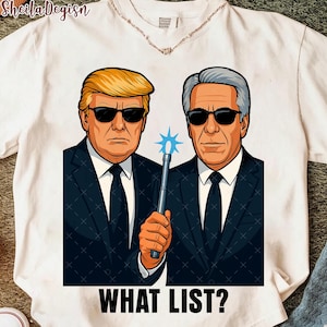May include: White t-shirt featuring a cartoon illustration of two men in suits and sunglasses. One man holds a glowing blue wand. The text "WHAT LIST?" is printed at the bottom of the graphic.