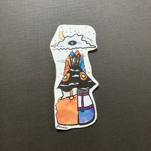 May include: A sticker featuring a stylized illustration of a person with a cloud for a head, a single eye, and a colorful outfit. The person is wearing a black dress with a white and blue pattern, a yellow belt, and a blue and orange skirt. The sticker is signed "Finnia".