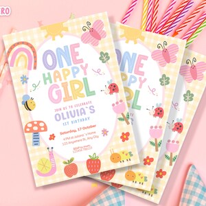 May include: A stack of three birthday invitations with a pastel color scheme. The invitations feature the text "ONE HAPPY GIRL" and include illustrations of a rainbow, butterfly, bee, and ladybug. The invitations are for Olivia's 1st birthday.