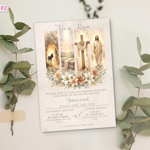 May include: An Easter-themed invitation card with the text "He is Risen." The card features illustrations of a tomb, a cross, and Jesus. Floral accents and event details are included. The card is surrounded by eucalyptus branches.