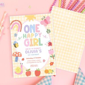 May include: A birthday invitation with the text "ONE HAPPY GIRL" in colorful letters, surrounded by illustrations of a rainbow, bee, ladybug, and other cute elements. The invitation is on a yellow gingham background.