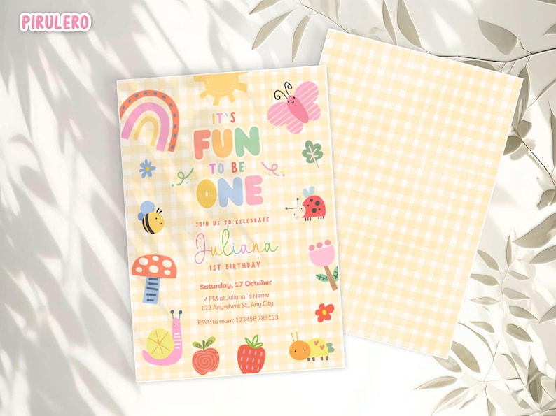 May include: A cheerful invitation for a first birthday celebration. The design features a yellow gingham pattern, a rainbow, sun, butterfly, and other cute illustrations. The text reads "It's Fun to be One" and includes the name "Juliana".