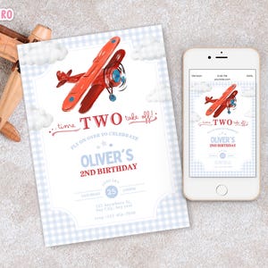 May include: A birthday invitation with a red airplane graphic, the text "TWO take off!" and "Oliver's 2nd Birthday." A wooden toy airplane is in the background, and a smartphone displays the invitation. The invitation is on a light blue gingham background.