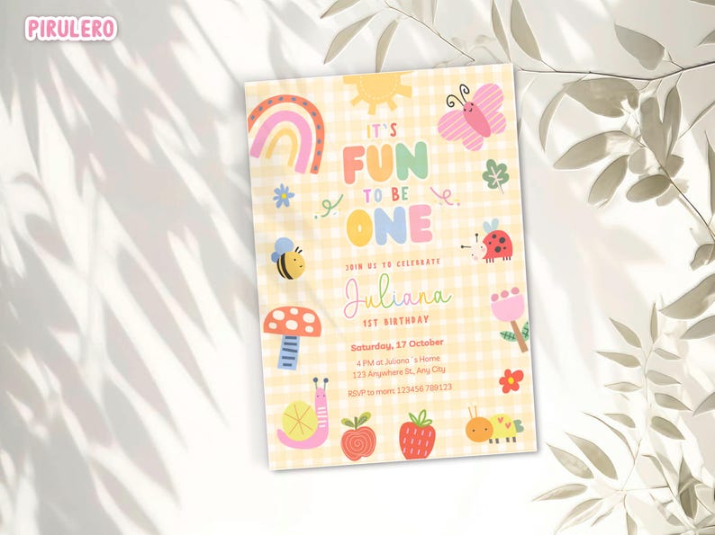 May include: A colorful birthday invitation with the text "It's Fun to Be One" and the name "Juliana". The design includes a rainbow, sun, butterfly, bee, ladybug, mushroom, snail, apple, strawberry, and caterpillar.