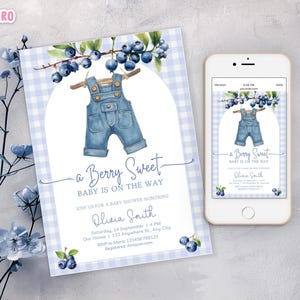 May include: A baby shower invitation with a watercolor design. The invitation features a pair of denim overalls hanging on a clothesline under a blueberry branch. The text reads "a Berry Sweet, Baby is on the Way". A smartphone displays the same design.