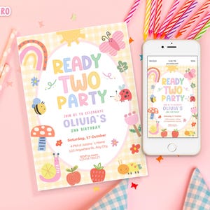 May include: A birthday party invitation and a smartphone displaying the same design. The invitation reads "READY TWO PARTY" with colorful illustrations of a rainbow, butterfly, and other cute elements. The phone screen mirrors the invitation's design.