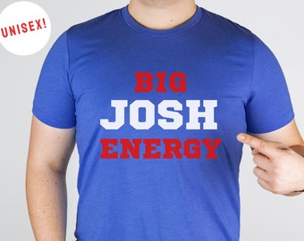 May include: A royal blue t-shirt with the text "BIG JOSH ENERGY" in red and white letters.