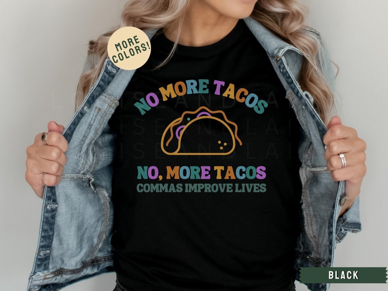 May include: Black t-shirt with a colourful graphic that says "No More Tacos, No, More Tacos, Commas Improve Lives".