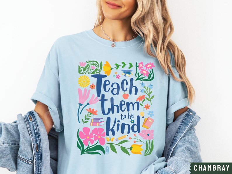 May include: Light blue t-shirt with a floral design and the text "Teach them to be kind".