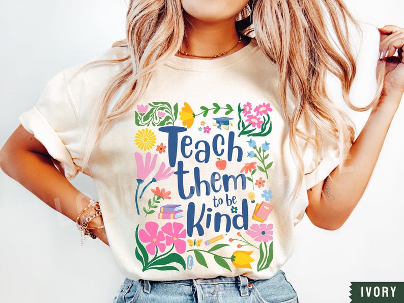 May include: A white t-shirt with a floral design and the text "Teach them to be kind".