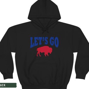 May include: Black hooded sweatshirt with the text "LET'S GO" in blue and a red buffalo silhouette.